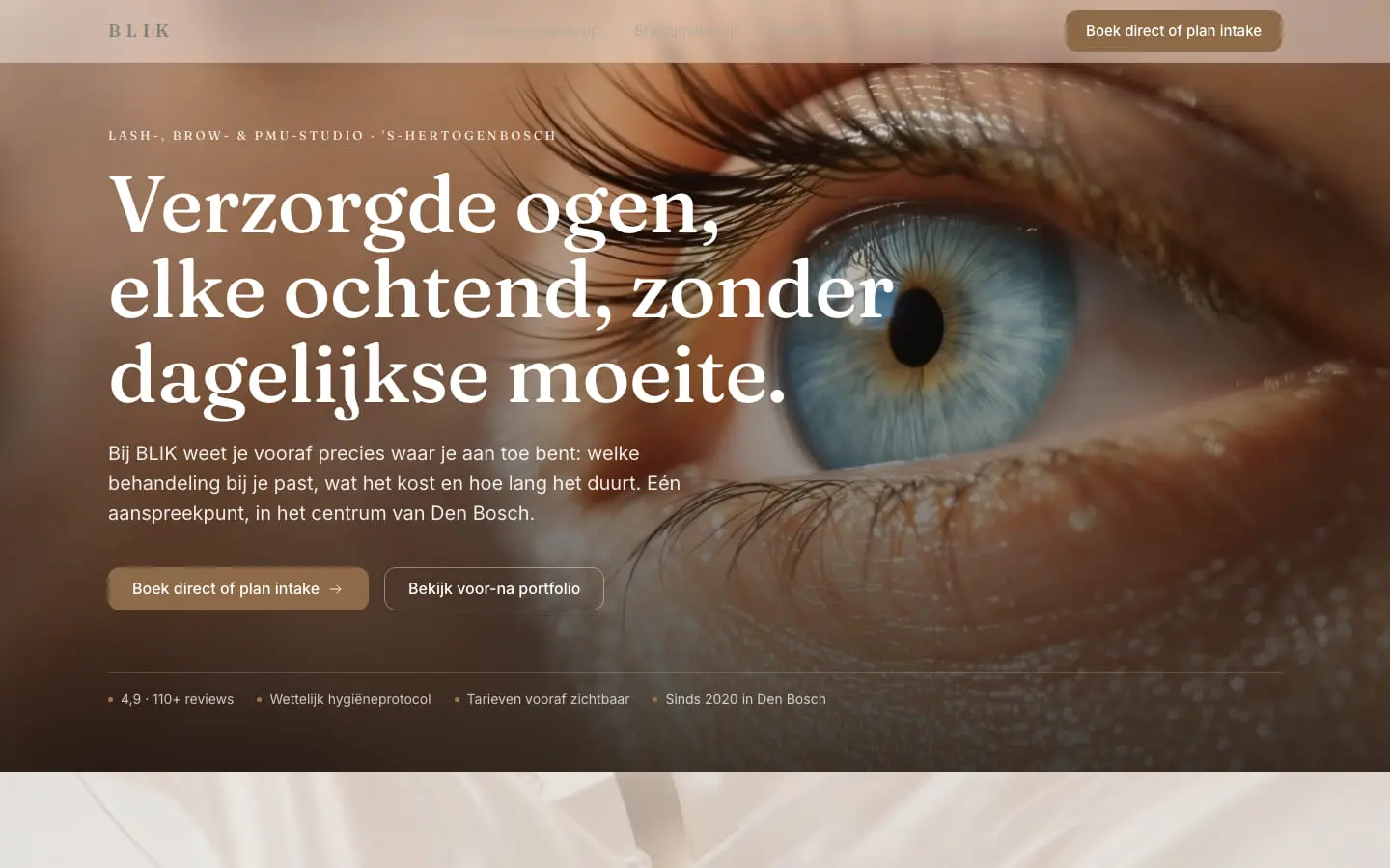 De homepage van BLIK nu, op een laptop: een scherp, licht beeld van een oog en een wenkbrauw achter de kop